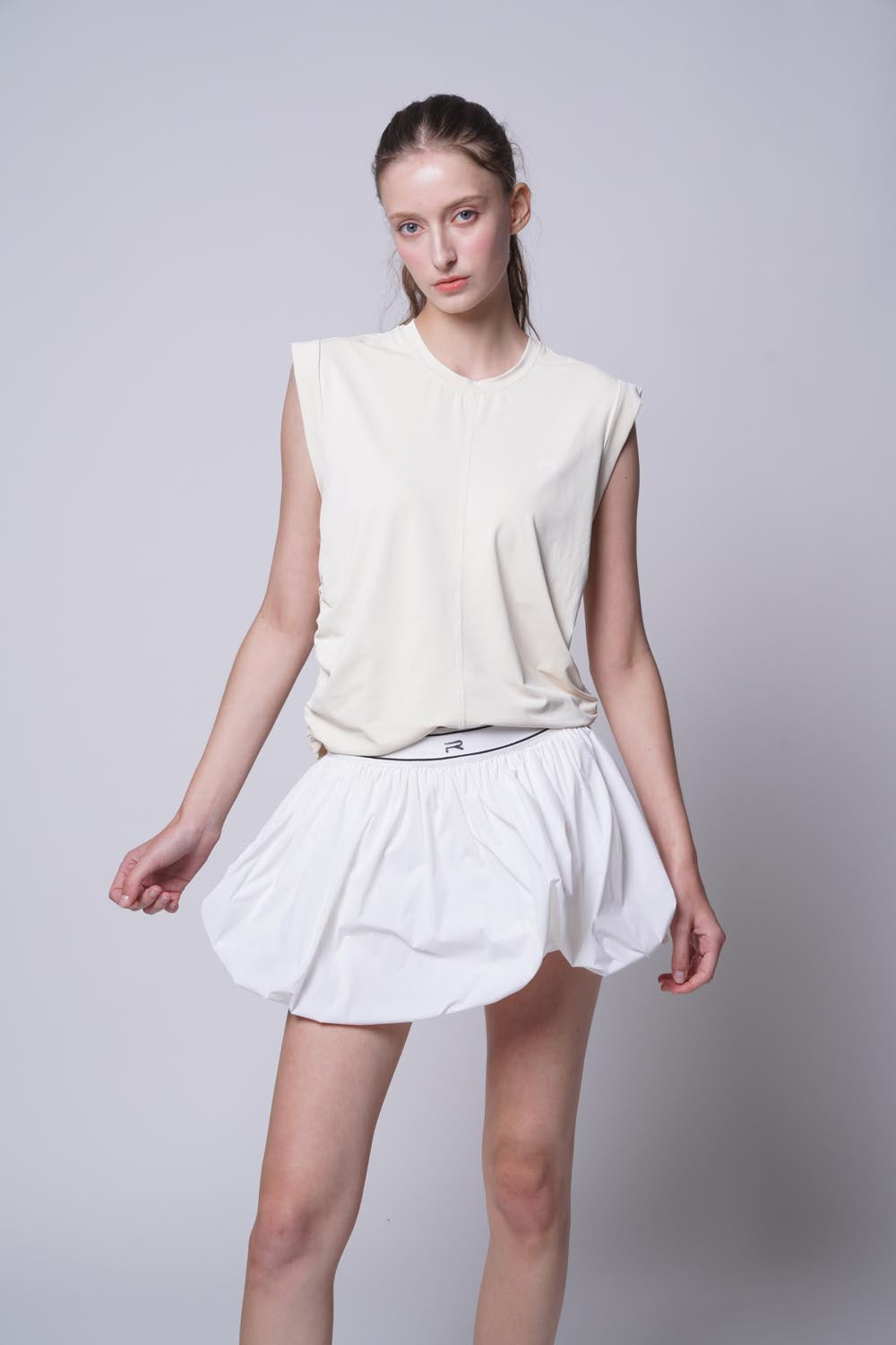 Female model wearing Court Flow Bubble Skirt in white