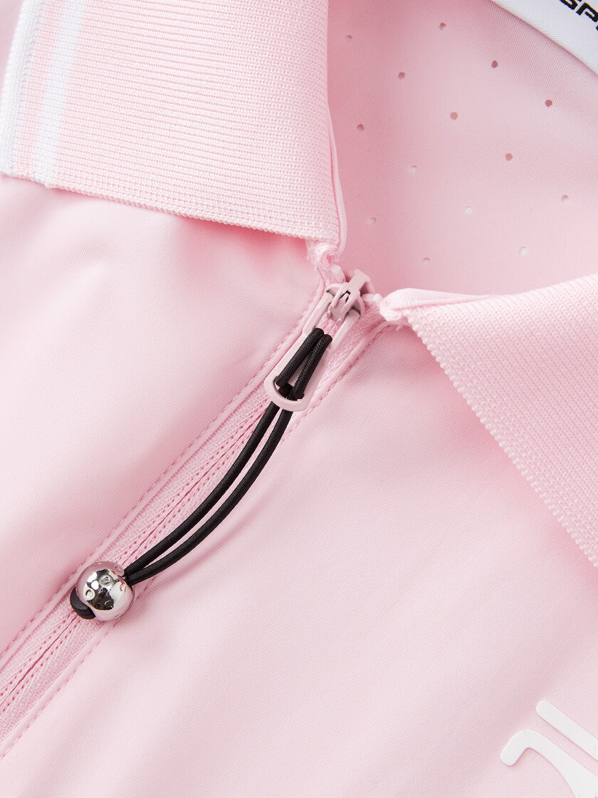 Closer view of Ramsports serve zip crop polo in pink